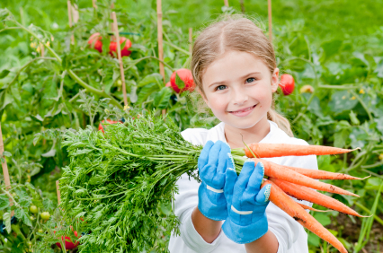 young girl holding carrots